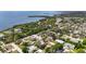 Scenic aerial view of waterfront homes with lush foliage near a tranquil bay at 1037 Jamaica Way, Tarpon Springs, FL 34689
