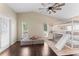 ' bedroom with a wooden ceiling fan, a bunk bed with slide, and hardwood flooring at 1037 Jamaica Way, Tarpon Springs, FL 34689