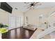 Comfortable bedroom with a ceiling fan, bunk bed with slide, and hardwood flooring at 1037 Jamaica Way, Tarpon Springs, FL 34689
