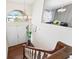 Bright foyer with hardwood floors, chandelier, and view into dining room through the entry way at 1037 Jamaica Way, Tarpon Springs, FL 34689