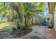 Backyard space featuring a patio, lush tropical landscaping, and a seating area at 11511 113Th St # 22E, Largo, FL 33778