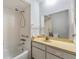 Bathroom featuring a tiled shower and a vanity with a mirror and ample counter space at 11511 113Th St # 22E, Largo, FL 33778