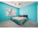 Bedroom with light blue walls, a window, and carpet at 11511 113Th St # 22E, Largo, FL 33778