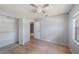 Bright bedroom with wood laminate flooring and closet with ample storage at 11511 113Th St # 22E, Largo, FL 33778