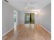 Spacious bedroom featuring new floors and sliding glass door at 11511 113Th St # 22E, Largo, FL 33778