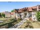 Charming townhome with a well-maintained lawn and a welcoming walkway to the front door at 11511 113Th St # 22E, Largo, FL 33778