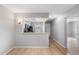 View from the living room to the kitchen with updated appliances at 11511 113Th St # 22E, Largo, FL 33778