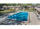 Community pool surrounded by lounge chairs for residents to relax and soak up the sun at 11511 113Th St # 22E, Largo, FL 33778