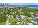 Aerial view of neighborhood, coastline, and skyline in the background with home indicated by a red arrow at 116 19Th Se Ave, St Petersburg, FL 33705