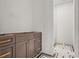 Stylish bathroom features a wood vanity, designer fixtures, and mosaic tile floor at 116 19Th Se Ave, St Petersburg, FL 33705