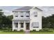 Charming two-story home boasts a white exterior, stylish gray shutters, and a well-manicured front lawn at 116 19Th Se Ave, St Petersburg, FL 33705