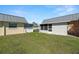 Spacious backyard featuring well-maintained lawn, perfect for outdoor activities and relaxation at 11719 Boynton Lane, New Port Richey, FL 34654