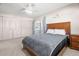 Comfortable bedroom featuring a queen-sized bed, ample closet space, and access to the enclosed lanai at 11719 Boynton Lane, New Port Richey, FL 34654
