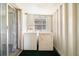 Convenient laundry area equipped with a washing machine and dryer at 11719 Boynton Lane, New Port Richey, FL 34654