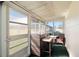 Relaxing sunroom featuring comfortable seating and ample natural light at 11719 Boynton Lane, New Port Richey, FL 34654