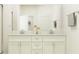 Elegant bathroom with double sinks, granite countertops, and modern fixtures at 11861 Sparkling Topaz Cv, Parrish, FL 34219