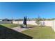 Expansive backyard offers ample green space with a stone patio and mature landscaping at 12103 Gothic Rd, Spring Hill, FL 34610