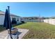 Large backyard with a patio area, ideal for outdoor entertaining and relaxation at 12103 Gothic Rd, Spring Hill, FL 34610
