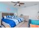 Comfortable bedroom featuring a ceiling fan, and a neatly made bed at 12103 Gothic Rd, Spring Hill, FL 34610