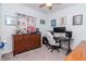 Cozy bedroom featuring neutral carpet, ceiling fan, and large window with decorative curtains at 12103 Gothic Rd, Spring Hill, FL 34610