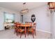 Dining room boasts modern lighting and a wooden table with six chairs at 12103 Gothic Rd, Spring Hill, FL 34610