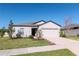 Inviting single-Gathering home with landscaped front yard and attached two-car garage at 12103 Gothic Rd, Spring Hill, FL 34610