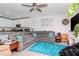 Comfortable living room with a plush sectional sofa and open to the kitchen at 12103 Gothic Rd, Spring Hill, FL 34610