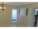 Dining area featuring tile flooring, bright window, and chandelier lighting at 12611 Touchton Dr # 122, Tampa, FL 33617