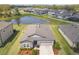 Picturesque aerial view of home and property with scenic pond and backyard at 12647 Retreat Pl, Spring Hill, FL 34610