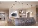 Stylish bar area featuring pendant lighting, wood countertop, and designer chairs at 12677 Lily Quartz Loop, Parrish, FL 34219