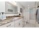 Bathroom with granite counter and vanity plus shower and tub combination at 13596 Croft N Dr, Largo, FL 33774