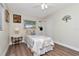 Bedroom with wood flooring and a side table at 13596 Croft N Dr, Largo, FL 33774