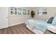 Bedroom with wood floors, window, and blue comforter at 13596 Croft N Dr, Largo, FL 33774