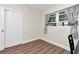 Bedroom with wood floors and a window at 13596 Croft N Dr, Largo, FL 33774