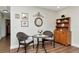 Charming breakfast nook with wooden floors, a round table, and a decorative hutch at 13596 Croft N Dr, Largo, FL 33774