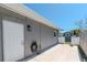 Exterior view of a home featuring a side door, patio, and storage shed in the backyard at 13596 Croft N Dr, Largo, FL 33774