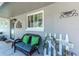 Inviting front porch area featuring a comfortable bench, and welcoming decorations at 13596 Croft N Dr, Largo, FL 33774