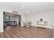 Open concept living room featuring modern furniture and wood flooring at 13596 Croft N Dr, Largo, FL 33774