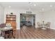 Open-concept living area with wood flooring, neutral walls, and stylish furniture at 13596 Croft N Dr, Largo, FL 33774
