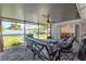Screened-in patio and backyard offering a seamless transition between indoor and outdoor spaces at 13596 Croft N Dr, Largo, FL 33774