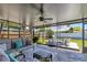 Inviting screened-in patio with outdoor furniture and view of the expansive backyard with patio at 13596 Croft N Dr, Largo, FL 33774