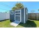 Storage shed in a well-kept backyard, offering extra space for tools and equipment at 13596 Croft N Dr, Largo, FL 33774