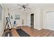 Well-lit workout room with wood floors, mirror, and easy access to the bathroom at 13596 Croft N Dr, Largo, FL 33774