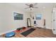Dedicated workout room with wood floors, mirrored wall, and fitness equipment at 13596 Croft N Dr, Largo, FL 33774
