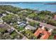 Aerial view showing waterfront proximity of the home, nestled among trees and greenery in a serene neighborhood at 1433 Park N St, St Petersburg, FL 33710