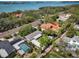 An aerial view of a home featuring a carport, landscaping, and proximity to a screened-in pool at 1433 Park N St, St Petersburg, FL 33710