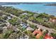 This aerial shot showcases the home's location near the water, nestled among lush trees in a serene neighborhood at 1433 Park N St, St Petersburg, FL 33710