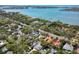 Picturesque aerial view of waterfront homes, lush trees, and the expansive blue bay at 1433 Park N St, St Petersburg, FL 33710