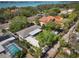 An aerial view of a home with a pool, landscaped yard and a spacious driveway at 1433 Park N St, St Petersburg, FL 33710