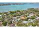 This aerial view features waterfront property with greenery and other houses at 1433 Park N St, St Petersburg, FL 33710